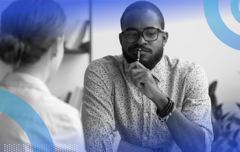A doubtful man questioning a colleague.