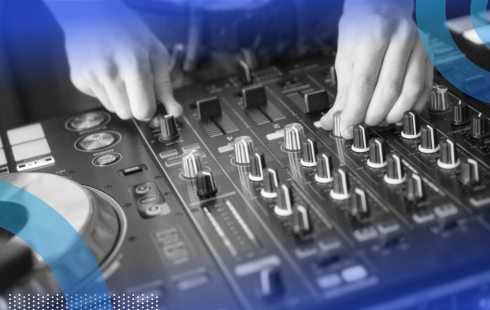 A close-up of someone tuning a DJ board.