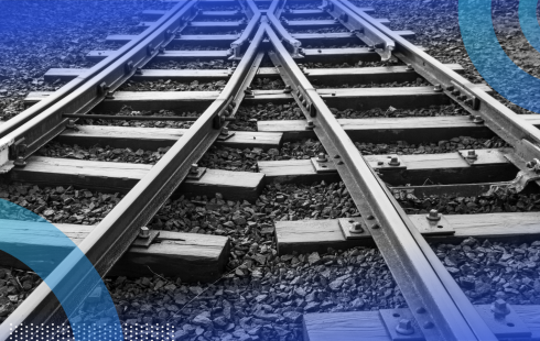 Two merging train tracks representing sql merging two tables