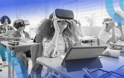 School kids are wearing VR headsets in a classroom.