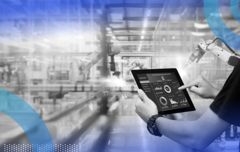 A construction worker using an iPad with controls and graphs on it to control a robot.