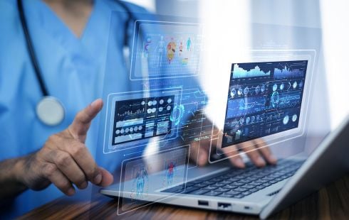 A physician uses medical software.