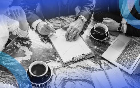 A group of executives work around a table