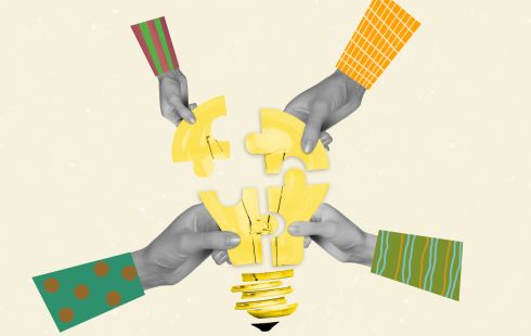 A collage of four arms in black and white holding a lightbulb made of puzzle pieces to show the idea of connection to people. 