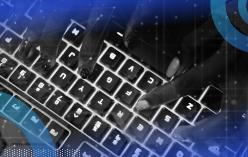 Hands typing on a glowing keyboard