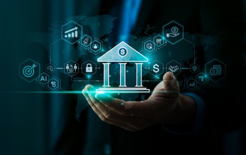 The image of a bank is held in someone's hand.