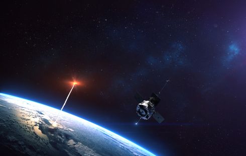 A glowing red object bursts out of the Earth's atmosphere and into space.