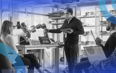 Robotics researchers studying robotic arm