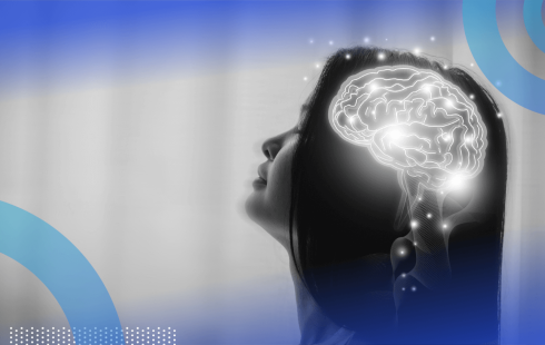An illuminated brain in a woman's head