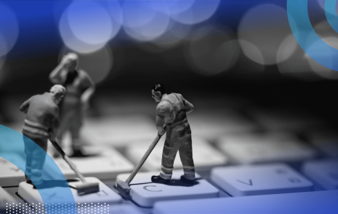 Tiny workers clean a keyboard