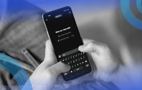 A closeup on a smartphone displaying the ChatGPT interface while someone uses it