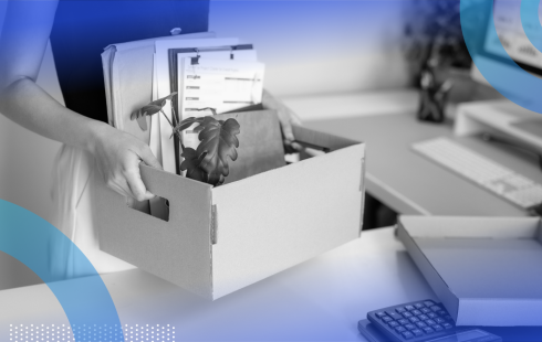 Employee packing up a box and leaving after being laid off