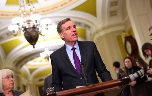 A politician speaks to the press.