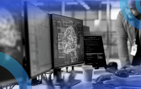 A group of white-collar workers look at a brain on a screen