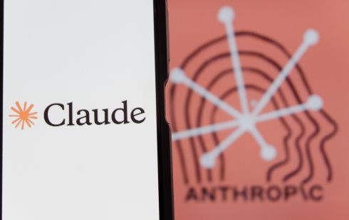 Image of smartphone screen with the Claude logo displayed, on top of a dark-orange background with the word "Anthropic" in black.