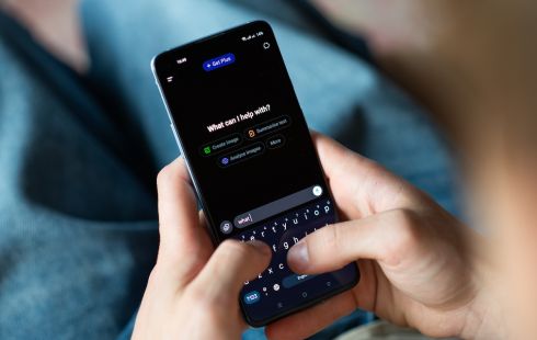 A person types a question into the ChatGPT app.