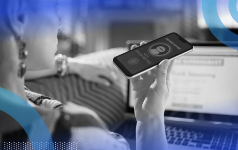 A young woman speaks to an AI interface on a smartphone