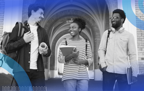 A group of students talk on a campus