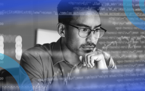 A software developer looks thoughtfully at a computer screen with an overlay of code