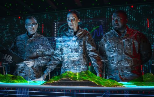 A photo of military personnel using advanced tech to show the idea of Caliola Engineering’s mission.