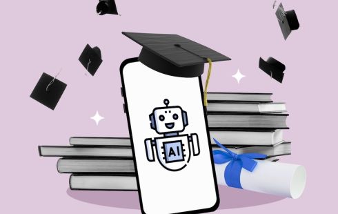 A mobile phone displaying robot has a mortarboard sitting atop it. Books and a diploma are in the background, along with other mortarboards thrown in the air. All this overlays a light-pink background.