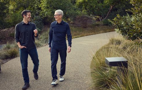 Apple CEO Tim Cook, right, walks with incoming CEO John Ternus at Apple Park.