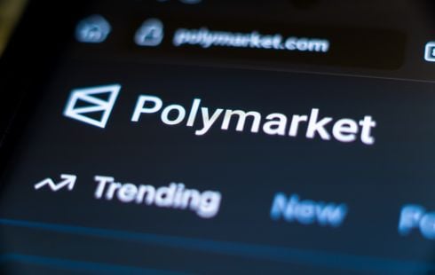A photo of the Polymarket logo on the computer