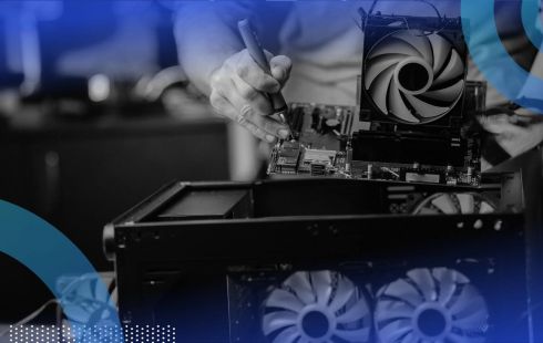 A technician repairs a computer