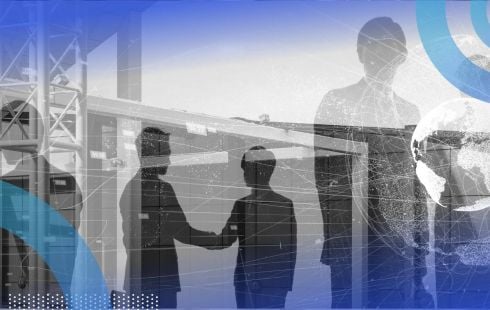 A group of workers interact underneath an overlay of a bridge, buildings, and a globe