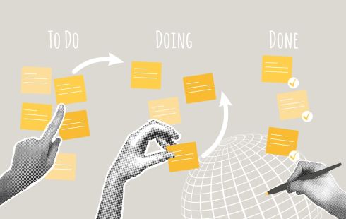 A person tracks the progress of a project using sticky notes, similar to a project management tool.