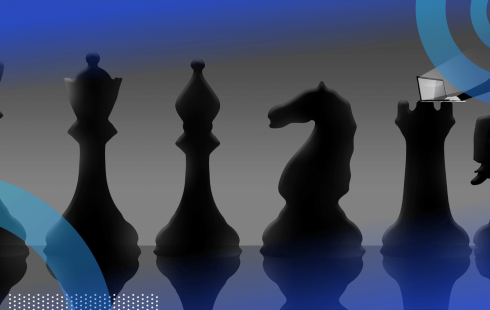 A series of chess pieces with someone sitting on the pawn working on a laptop