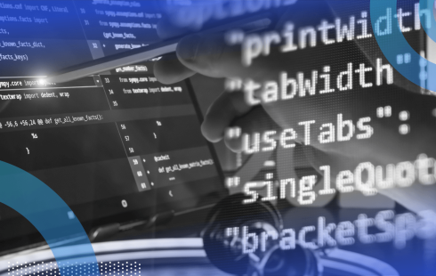 Lines of code overlaid atop an engineer using a stylus on a screen filled with code