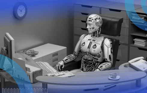 A robot sits at a desk