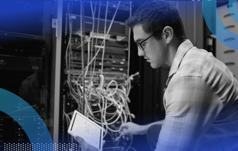 A network engineer works with a tablet