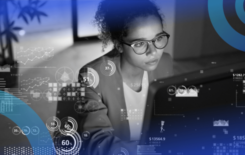 A woman works on a laptop with a data overlay