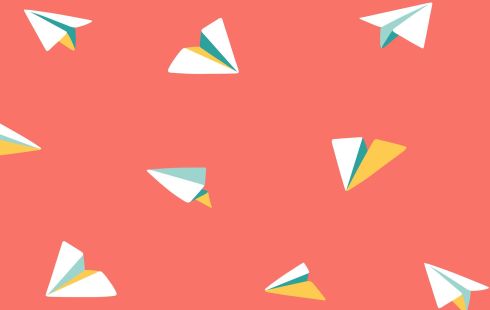 paper airplanes against a red background