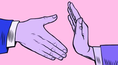 Two illustrated hands are pictured against a pink backdrop. One of the hands is extended for a handshake, but the handshake is blocked by the other hand — similar to the way an employer can block a new hire by rescinding a job offer.