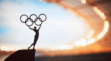 The silhouette of an Olympic statue is pictured.