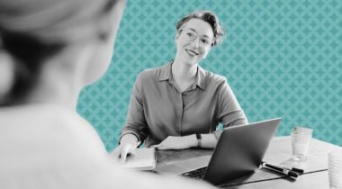 A hiring manager listens to a response from a job applicant.