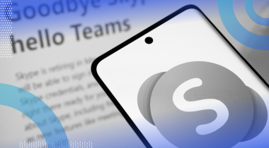 A smartphone with the Skype logo in front of a news item about its closure