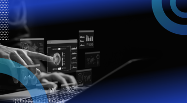 A systems analyst works on a laptop