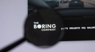 A photo of the Boring Company logo on a computer screen.