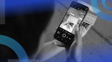 A person uses a smartphone to photograph an ID card