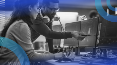 Two employees reviewing AI tool