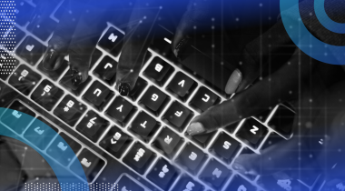 Hands typing on a glowing keyboard