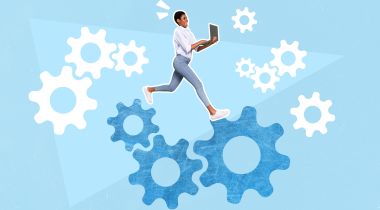 A woman holding a laptop stepping on gears on a blue background to show the idea of women in STEM and tech.