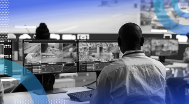 An AI-enhanced command center with workers on desktop screens