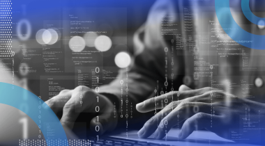 A closeup on the hands of a software developer with an overlay of zeros and ones