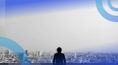 A person looks out from a balcony on a cityscape