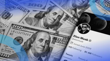 A smartphone showing Elon Musk's Twitter page atop a stack of hundred dollar bills